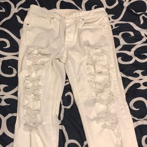all white ripped American eagle pants